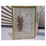 This is an antique convex glass or "bubble glass" portrait, popular from around 1880 to 1920.