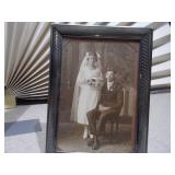 This is an antique convex glass or "bubble glass" portrait, popular from around 1880 to 1920.