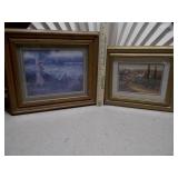 The image displays two framed art prints