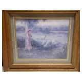 The image displays two framed art prints