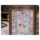 The image displays a collection of assorted framed prints and folk art paintings