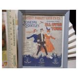 The image displays a collection of framed vintage advertisements