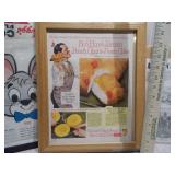 The image displays a collection of framed vintage advertisements