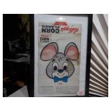 The image displays a collection of framed vintage advertisements