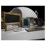 The image displays a variety of vintage or antique picture frames and mirrored trays.