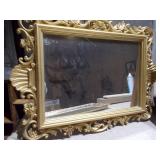 The image displays a variety of vintage or antique picture frames and mirrored trays.