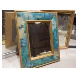 The image displays a variety of vintage or antique picture frames and mirrored trays.