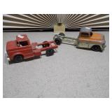 These are vintage TootsieToy diecast trucks, likely models from the 1950s or 1960