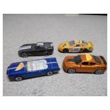 This is a collection of vintage die-cast toy cars, likely from brands such as Matchbox, Tootsietoy, or Lesney.