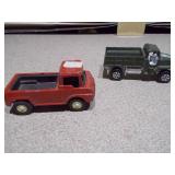 The image shows a collection of vintage die-cast toy vehicles, likely from the Tootsietoy brand