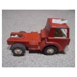 The image shows a collection of vintage die-cast toy vehicles, likely from the Tootsietoy brand