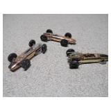 These are vintage Aurora Cigar Box die-cast Formula 1 toy cars.