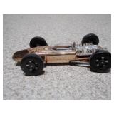 These are vintage Aurora Cigar Box die-cast Formula 1 toy cars.