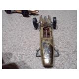 These are vintage Aurora Cigar Box die-cast Formula 1 toy cars.