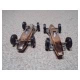 These are vintage Aurora Cigar Box die-cast Formula 1 toy cars.