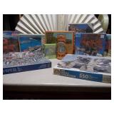 This image displays a collection of various jigsaw puzzles