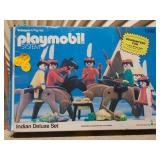 The image features two vintage toys: the Playmobil System Indian Deluxe Set #1102 and a toy called "the MAGIC designer