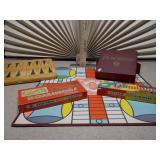 The image displays a collection of vintage board games, including a Parcheesi board and boxes, a backgammon board, and two boxes of HALSAM "Dragon Dominos