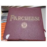 The image displays a collection of vintage board games, including a Parcheesi board and boxes, a backgammon board, and two boxes of HALSAM "Dragon Dominos