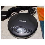 This appears to be a Memorex MD6451 portable CD player along with a Case Logic carrying case and two CDs.