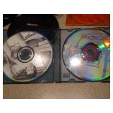 This appears to be a Memorex MD6451 portable CD player along with a Case Logic carrying case and two CDs.