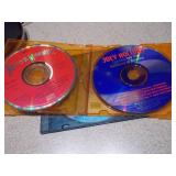 This appears to be a Memorex MD6451 portable CD player along with a Case Logic carrying case and two CDs.