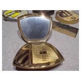 This is a collection of vintage or antique trinket, pill, or snuff boxes