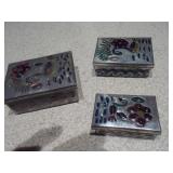 This is a collection of vintage or antique trinket, pill, or snuff boxes