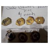 This image displays a collection of assorted vintage enamel pins