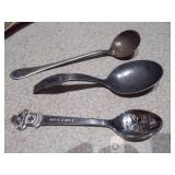 several "church key" style can and bottle openers, spoons, and other small metal objects.