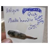 several "church key" style can and bottle openers, spoons, and other small metal objects.