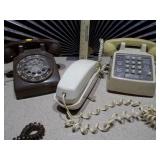 The image features a collection of vintage telephones