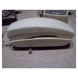 The image features a collection of vintage telephones