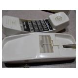 The image features a collection of vintage telephones