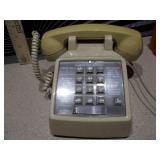 The image features a collection of vintage telephones