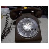 The image features a collection of vintage telephones