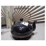 Chinese Famille Rose teapot and a second, black glazed teapot,