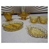 This is a collection of vintage Anchor Hocking Fairfield pattern amber glass dishes.