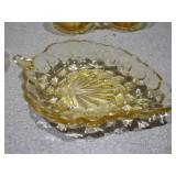 This is a collection of vintage Anchor Hocking Fairfield pattern amber glass dishes.