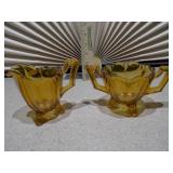 This is a collection of vintage Anchor Hocking Fairfield pattern amber glass dishes.