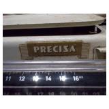 This is a vintage Precisa mechanical kitchen or balance scale