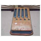 This is a vintage tin litho toy adding machine,