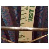 This is a mid-century modern atomic brass magazine rack