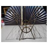 This is a mid-century modern atomic brass magazine rack