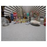 The collection includes various sizes, shapes, and colors of glass bottles