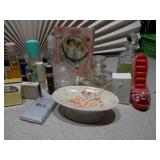 The collection includes various sizes, shapes, and colors of glass bottles