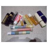 The collection includes various sizes, shapes, and colors of glass bottles