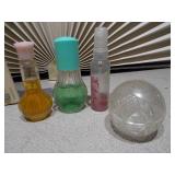 The collection includes various sizes, shapes, and colors of glass bottles