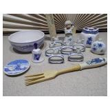 The image displays a collection of Delft blue and white ceramic items