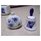 The image displays a collection of Delft blue and white ceramic items